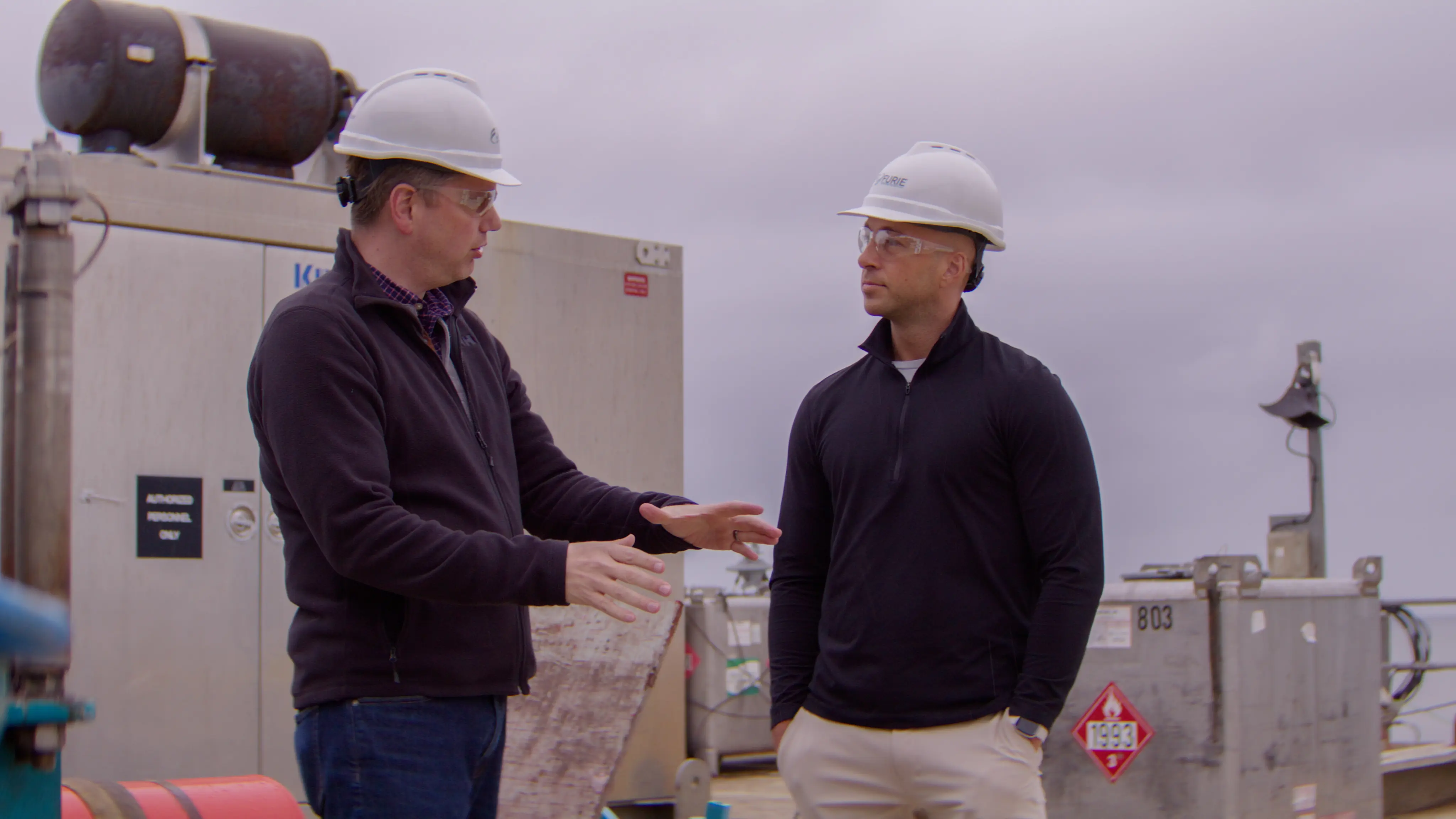 Congressman Begich in a hard hat touring an industrial site