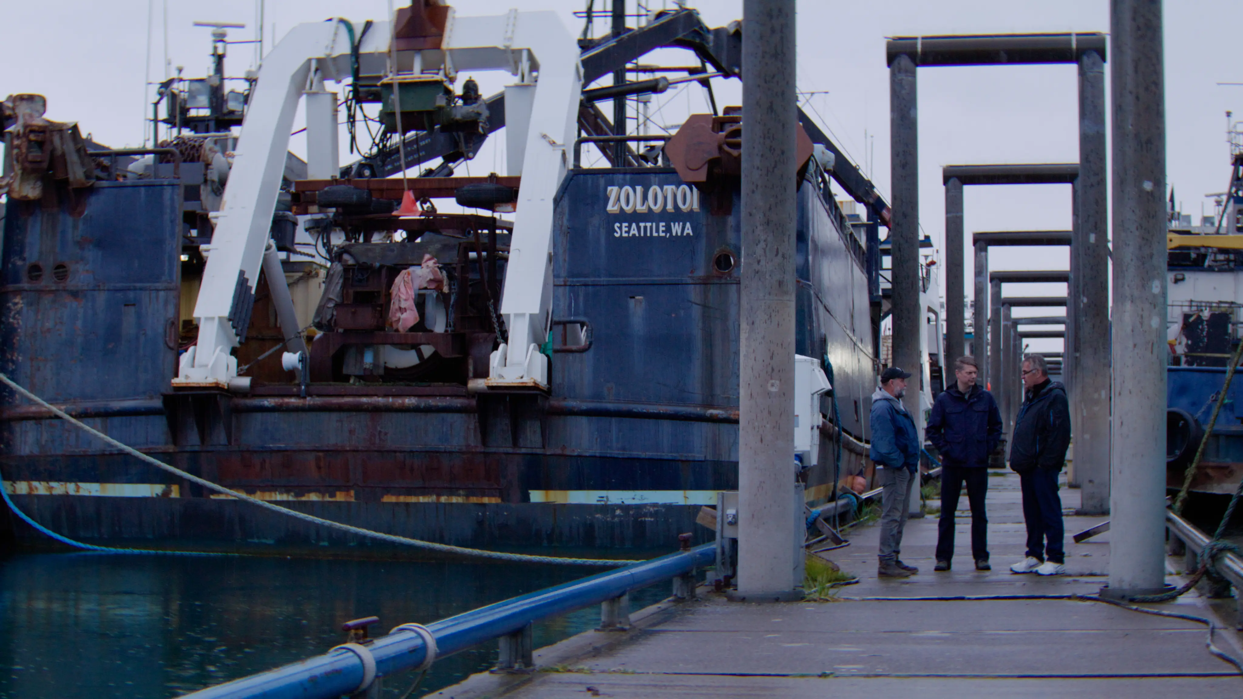 Congressman Begich touring a working dock beside a fishing vessel